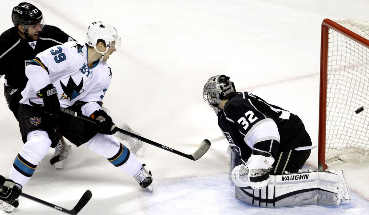 Sharks center Logan Couture (39) scores against Kings goalie Jonathan Quick in the first period on Jan. 21 in San Jose.