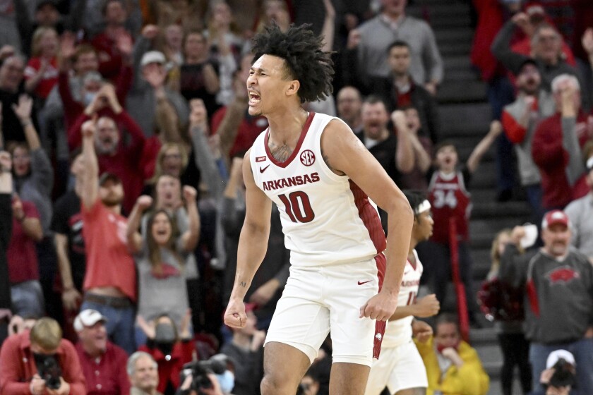 Arkansas forward Jaylin Williams (10) reacts after making a basket against Texas A&M with 7 seconds left during the first overtime period of an NCAA college basketball game Saturday, Jan. 22, 2022, in Fayetteville, Ark. (AP Photo/Michael Woods)