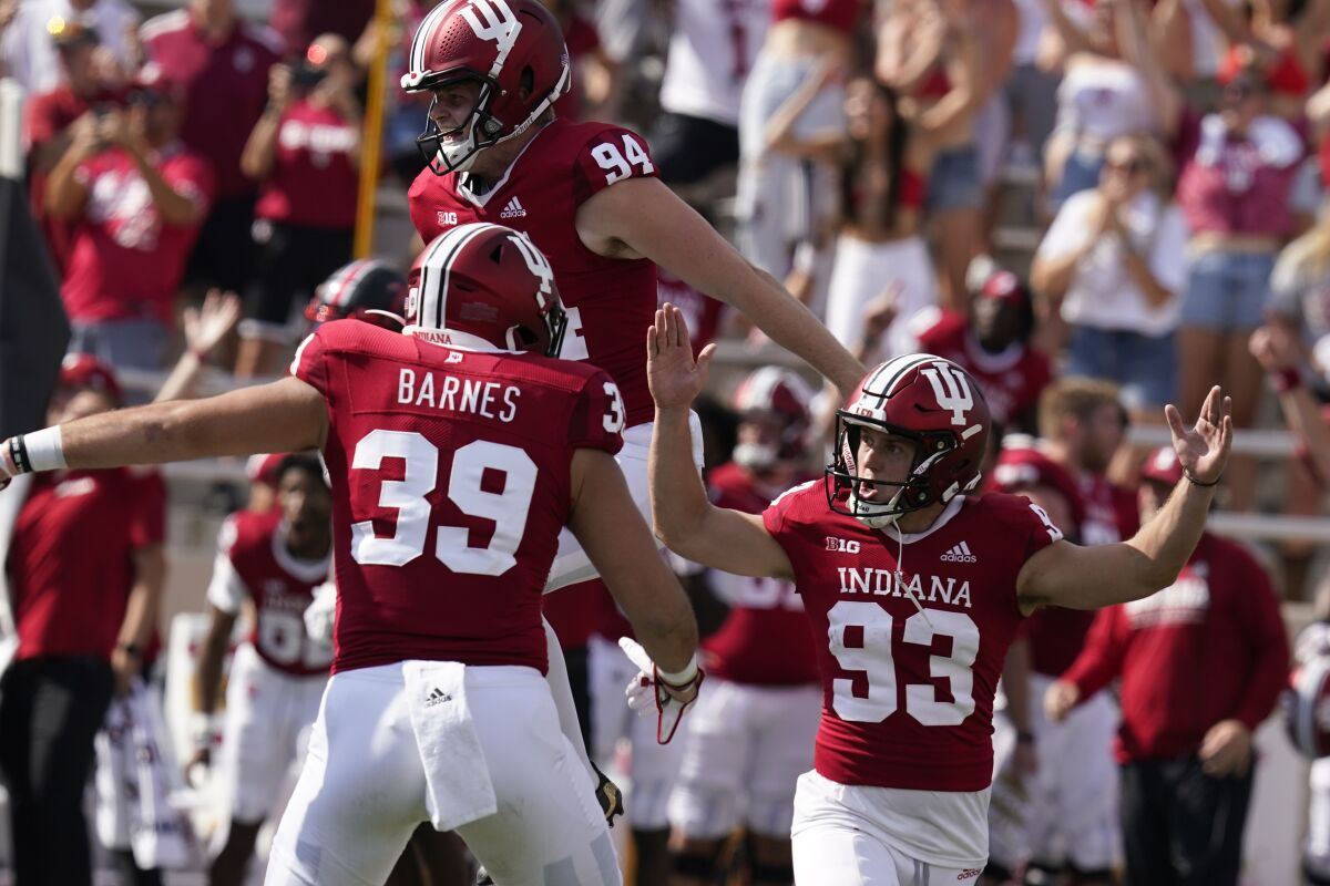 Indiana place kicker Charles Campbell (93) celebrates after kicking the game winning field goal during overtime of an NCAA college football game against Western Kentucky, Saturday, Sept. 17, 2022, in Bloomington, Ind. Indiana won 33-30 in overtime. (AP Photo/Darron Cummings)