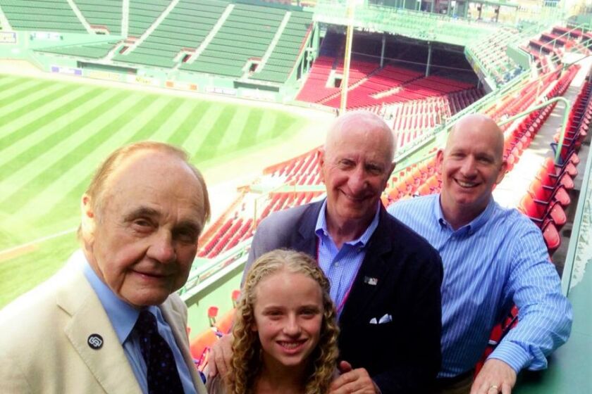 Sportscaster Dick Enberg, l, joins George Mitrovich (in sportcoat), his son Tim Mitrovich and granddauaghter Juliette.