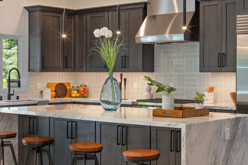 The kitchen in the Los Angeles home used natural stone marble from Raj Swenson’s parents’ San Diego company.