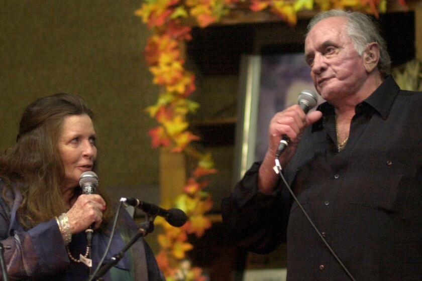 053286.CA.0928.cash 1 June Carter Cash and her husband Johnny Cash (right) sing a country tune together about marriage. The coupe performed at the Carter Fold in Hiltons, VA in front of an audience of over 1000 people. Photo by Josh Meltzer/FOR THE TIMES