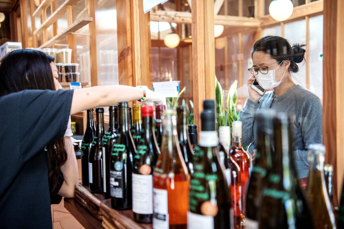 Emily Koh takes an order from a customer at Tilda.