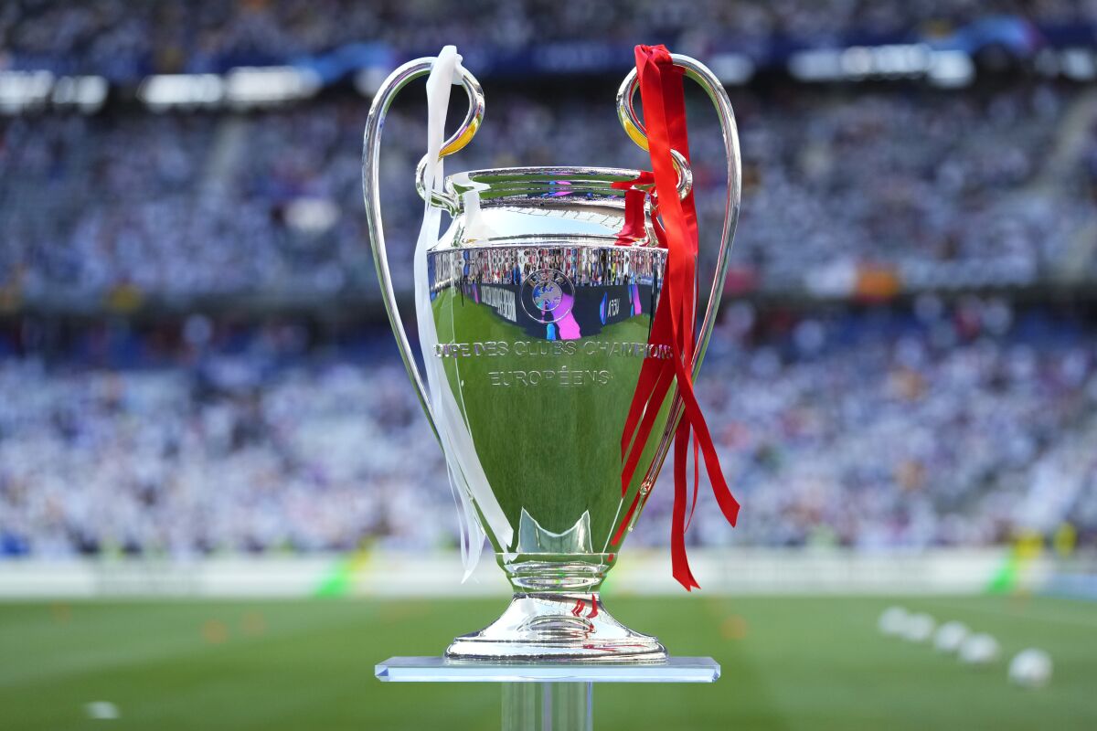 The trophy is displayed on the field before the Champions League final soccer match between Liverpool and Real Madrid at the Stade de France in Saint Denis near Paris, Saturday, May 28, 2022. (AP Photo/Petr David Josek)