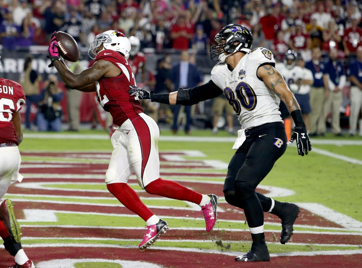 Cardinals strong safety Tony Jefferson (22) intercepts a throw intended for Ravens tight end Crockett Gillmore in the end zone during the final seconds. The Cardinals won 26-18.