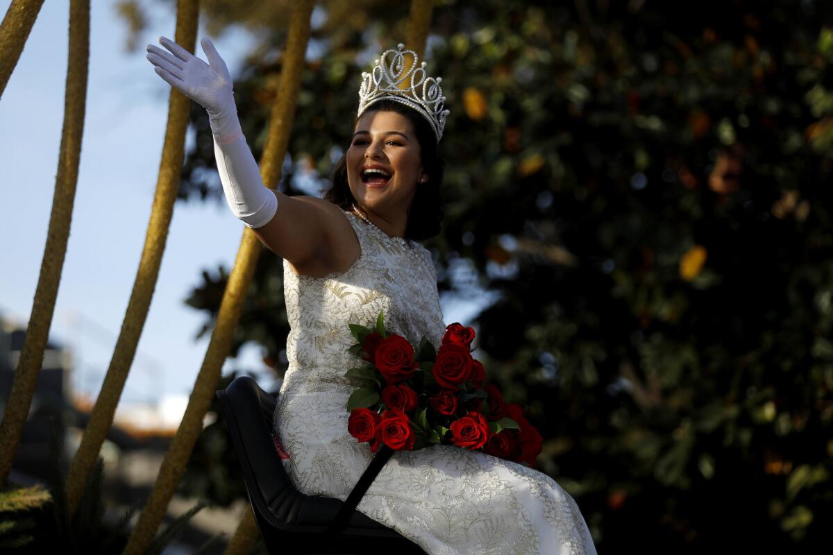 The Tournament of Roses 100th Rose Queen Isabella Marez waves to the crowd.