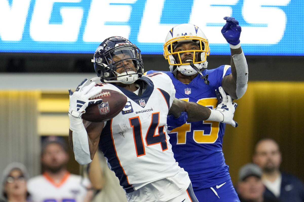 Broncos wide receiver Courtland Sutton catches a touchdown pass in front of Chargers cornerback Michael Davis.