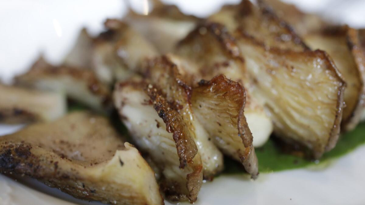 Grilled oyster mushrooms with stinging nettle cardamom puree, turmeric and sumac at Bavel.