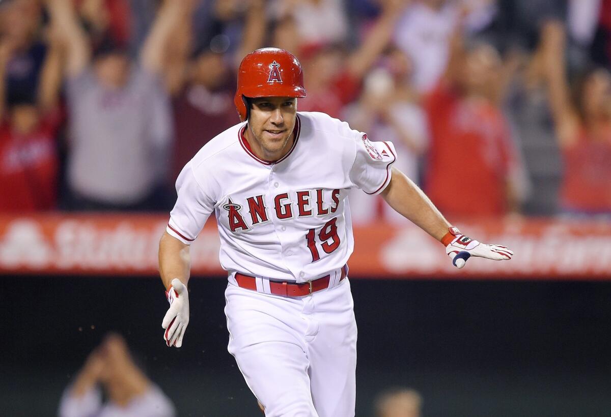 Angels' David Murphy celebrates as he runs to first after hitting a walk-off single against Oakland on Sept. 28.