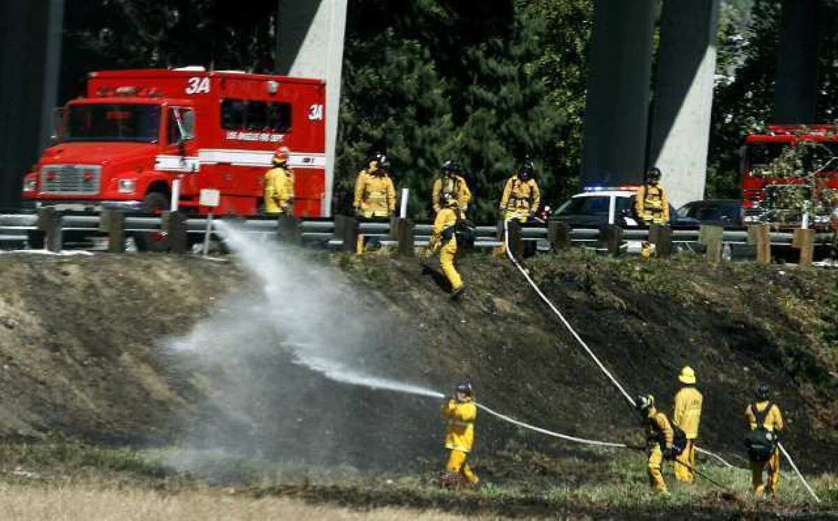 A small brush fire started in the field area between northbound Interstate 5 and westbound 134 in Glendale on Tuesday, April 16, 2013.
