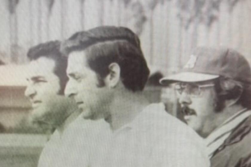 Former Hamilton football coach Jack Epstein (left), in a 1972 photo with assistant Ron Price.