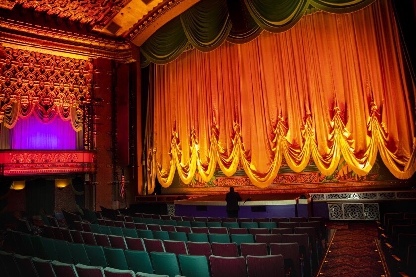 Inside the majestic El Capitan Theatre, with a  fancy curtain over the screen