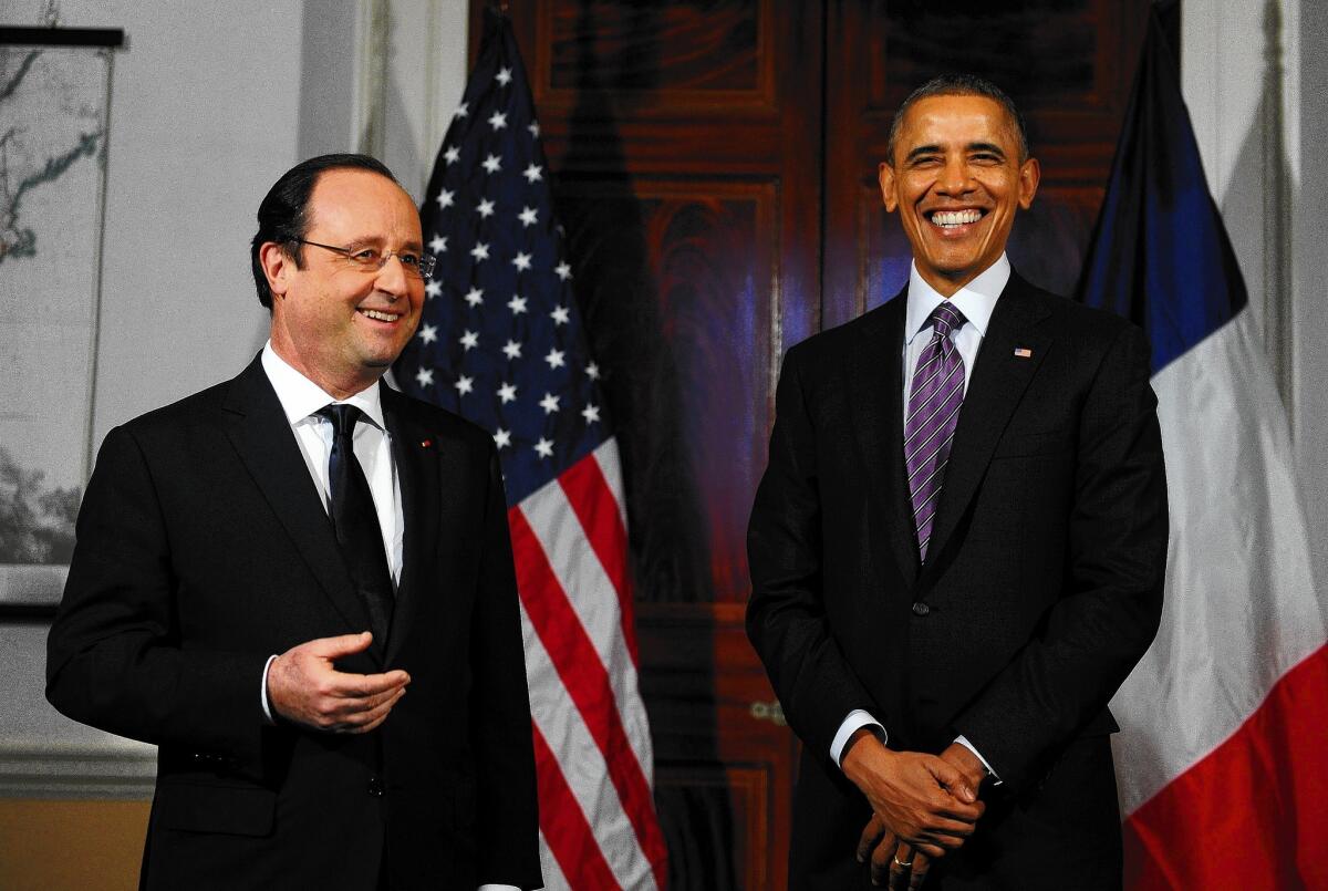 French President Francois Hollande, left, and President Obama tour Thomas Jefferson’s Monticello estate in Charlottesville, Va.