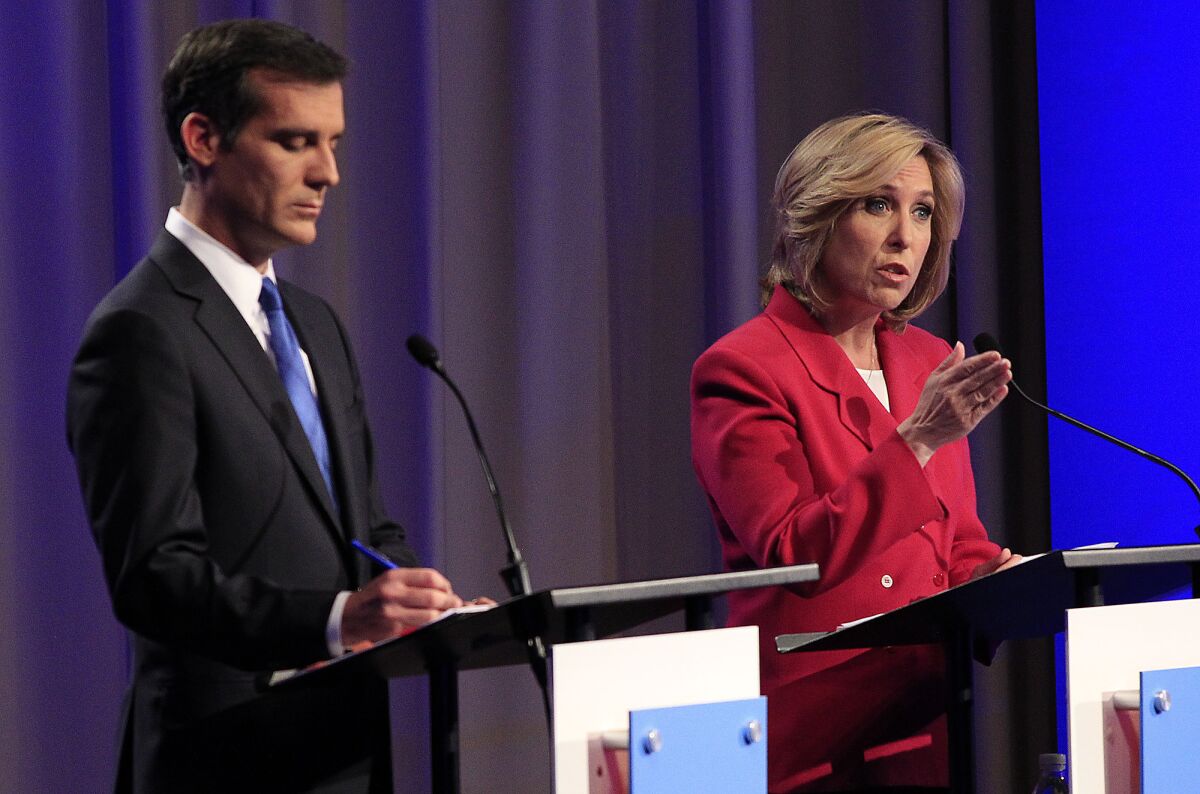 Los Angeles mayoral candidate Wendy Greuel, right, makes a point during Monday's debate with rival Eric Garcetti at USC's Health Sciences Campus.