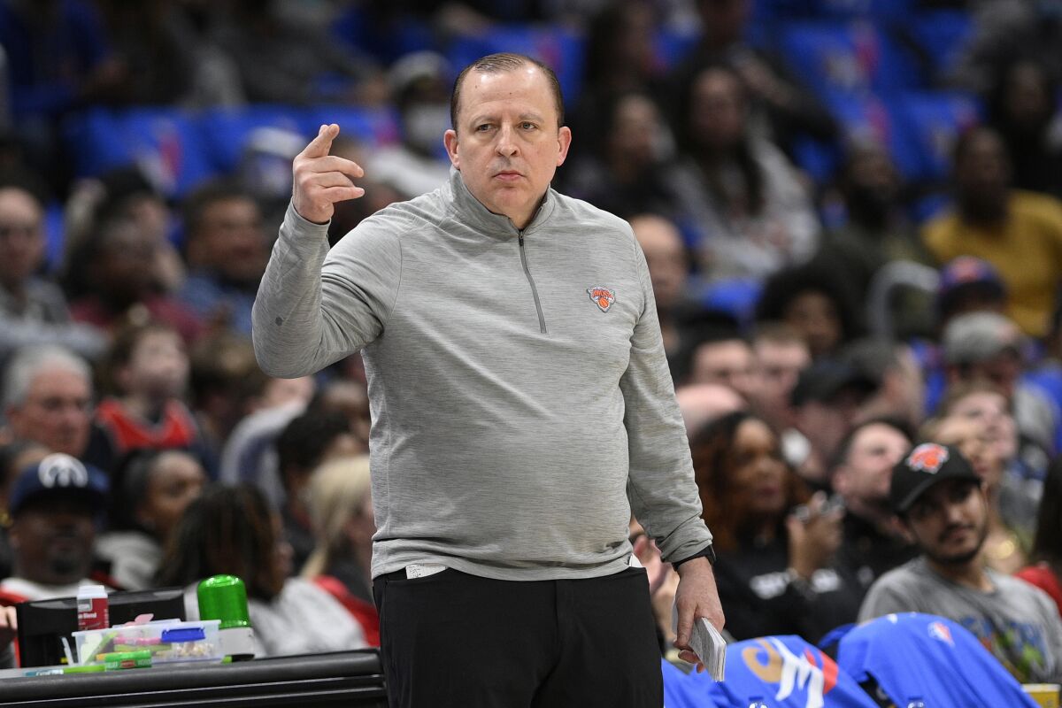 New York Knicks coach Tom Thibodeau gestures during the first half of the team's NBA basketball game against the Washington Wizards, Friday, April 8, 2022, in Washington. (AP Photo/Nick Wass)