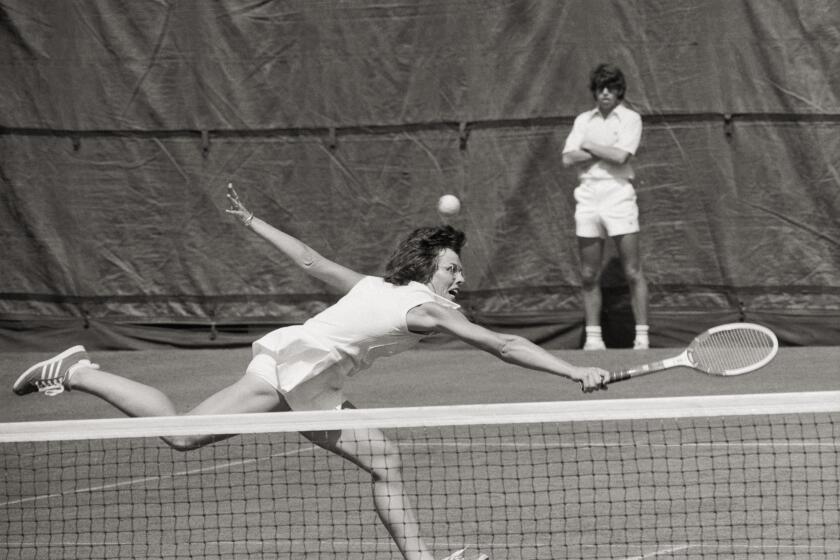 ****ONLY FOR USE WITH LATIMES COVERAGE OF BILLIE JEAN KING'S BOOK "ALL IN." NO OTHER USAGE***** A photograph from Billie Jean Kings book "All in." Playing serve-and-volley tennis fit my personality from the moment I took up the sport. It requires terrific movement and being comfortable anywhere on the court. Here, I'm hustling at the 1972 U.S. Open to hit a backhand volley, my strongest shot throughout my career. (Original Caption) The ball appeared to be over the head of Billie Jean King as she reached to serve during match against Patti Hogan of La Jolla, California, as the US Open Tennis Championships resumed. Billie Jean, the defending champion and Wimbledon queen, raced to a 6-3, 6-2 victory, marking the 8th time she whipped Patti in 8th meetings, during which Miss Hogan had failed to take a set. Credit: George Kalinsky / Bettmann / Getty Images
