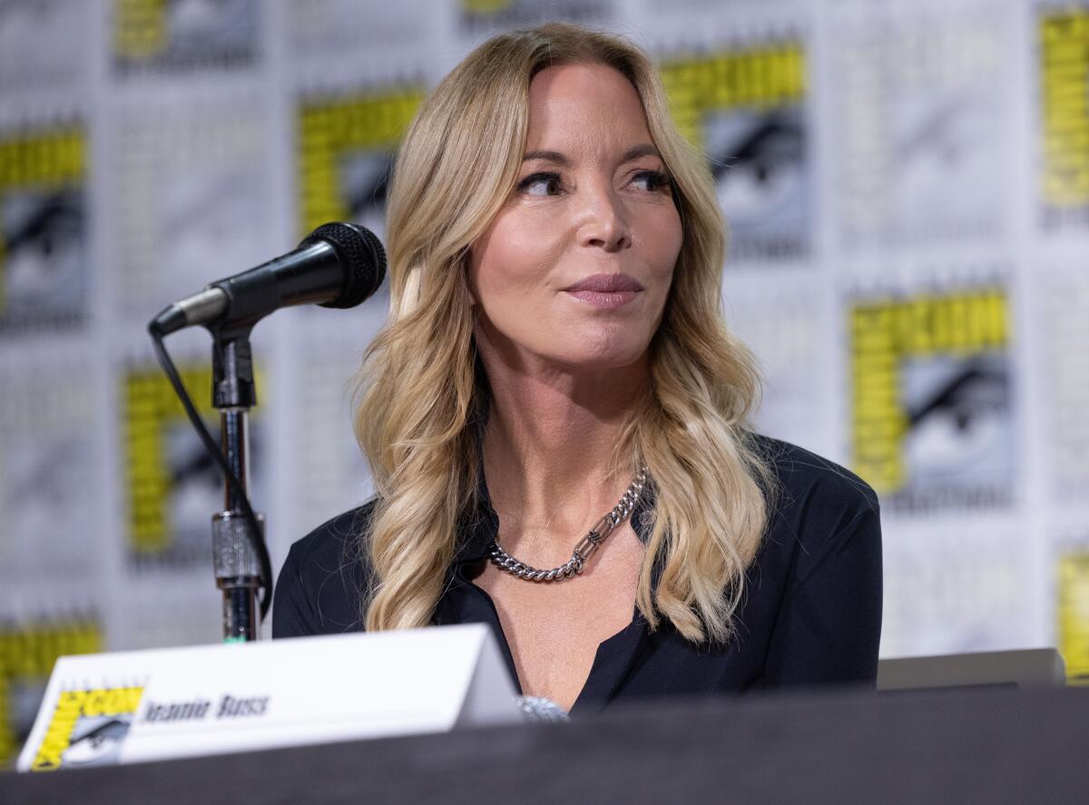 Jeanie Buss sitting at a San Diego Com-Con panel table