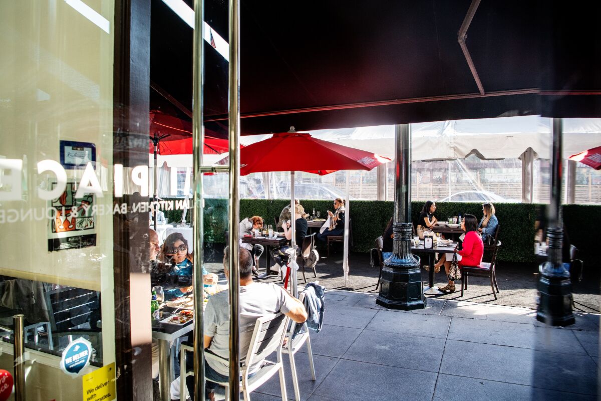 A restaurant seating area with outdoor dining