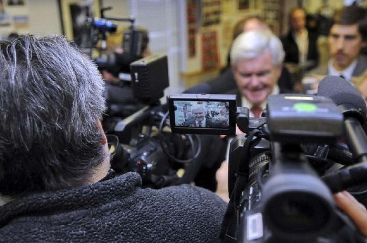 Newt Gingrich speaks to the media at Tommy's Ham House in Greenville, S.C.