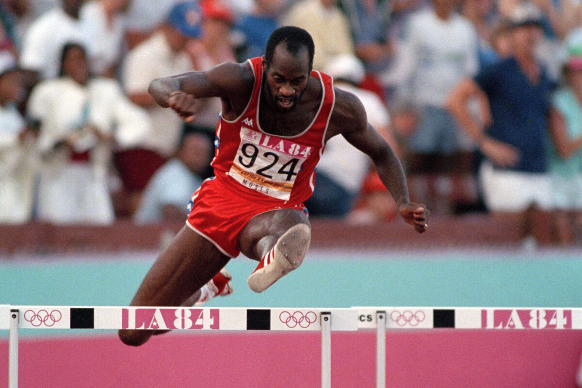 FILE - In this Aug. 5, 1984, file photo, United States' Edwin Moses jumps a hurdle on his way to winning the gold medal in the 400-meter hurdles at the Summer Olympic Games in Los Angeles. (AP Photo/File)
