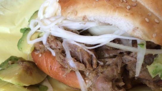 The cemita with pork in green chile.
