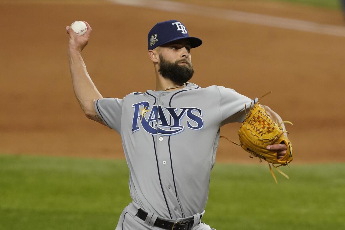 Tampa Bay Rays relief pitcher Nick Anderson throws against the Dodgers.