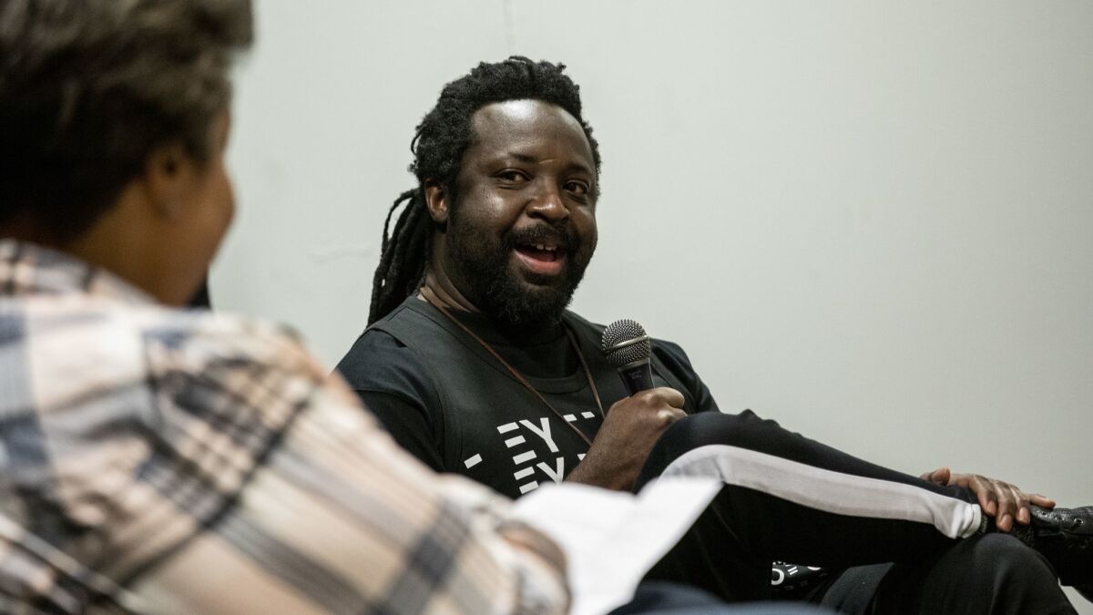Writer and editor Roxanne Gay interviews author Marlon James about his latest book, "Black Leopard, Red Wolf," at Los Angeles' Museum of African American Art on Feb 20.