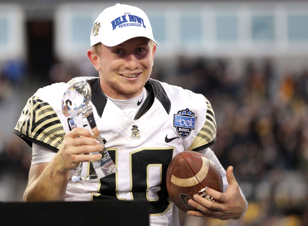 Wake Forest quarterback John Wolford celebrates after being named the MVP of the Belk Bowl.