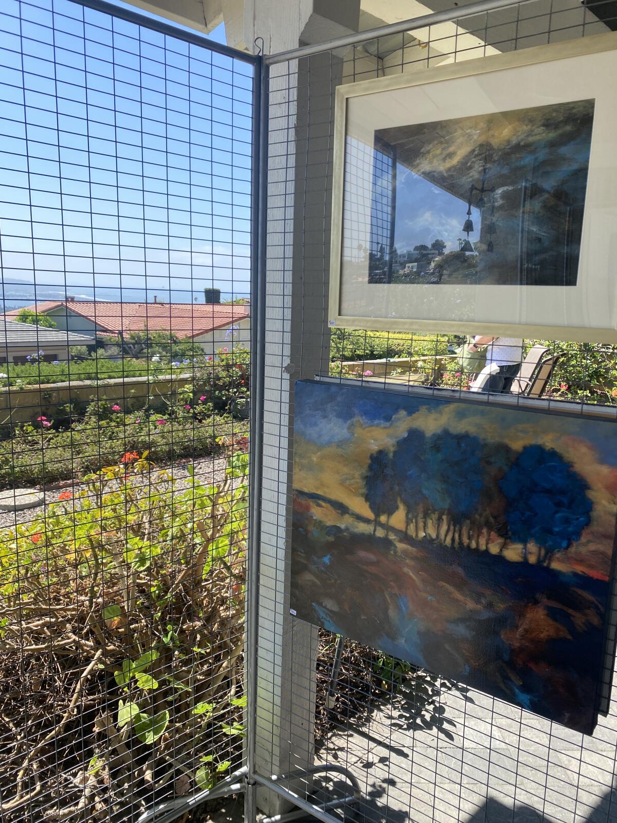 Painter Betty Hock's works hang on the back patio of Jane Fletcher's La Jolla home.