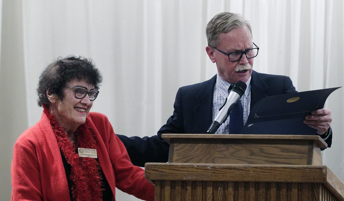 Harriet Hammons, who was given the Community Spirit Award during the LCF Chamber installation dinner smiles to the crowd as emcee Chris Erskine reads her certificate.