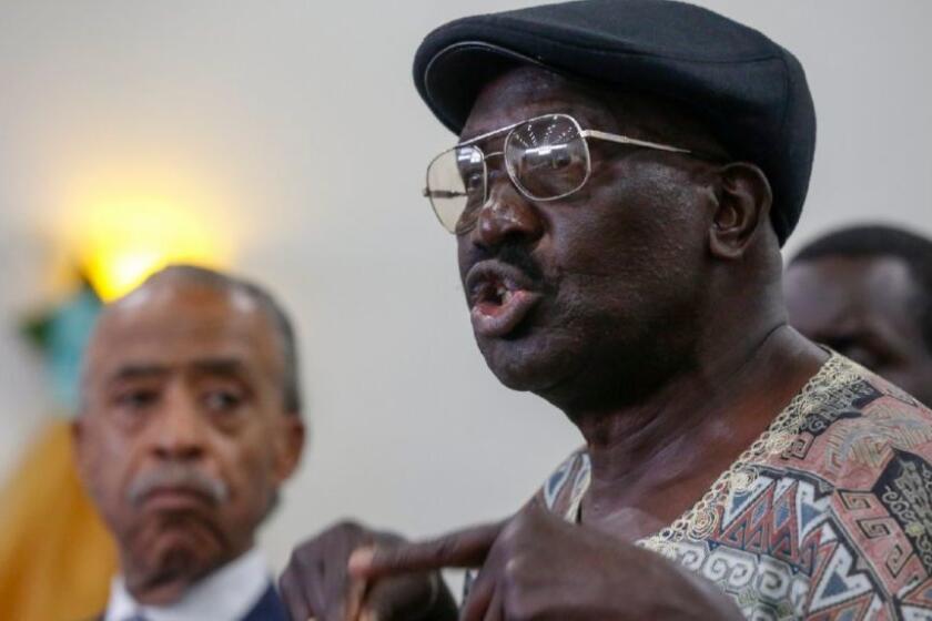 Richard Olango, whose son was killed by El Cajon police in September, spoke at a South Los Angeles news conference in October. Olango filed a lawsuit against police on Tuesday.