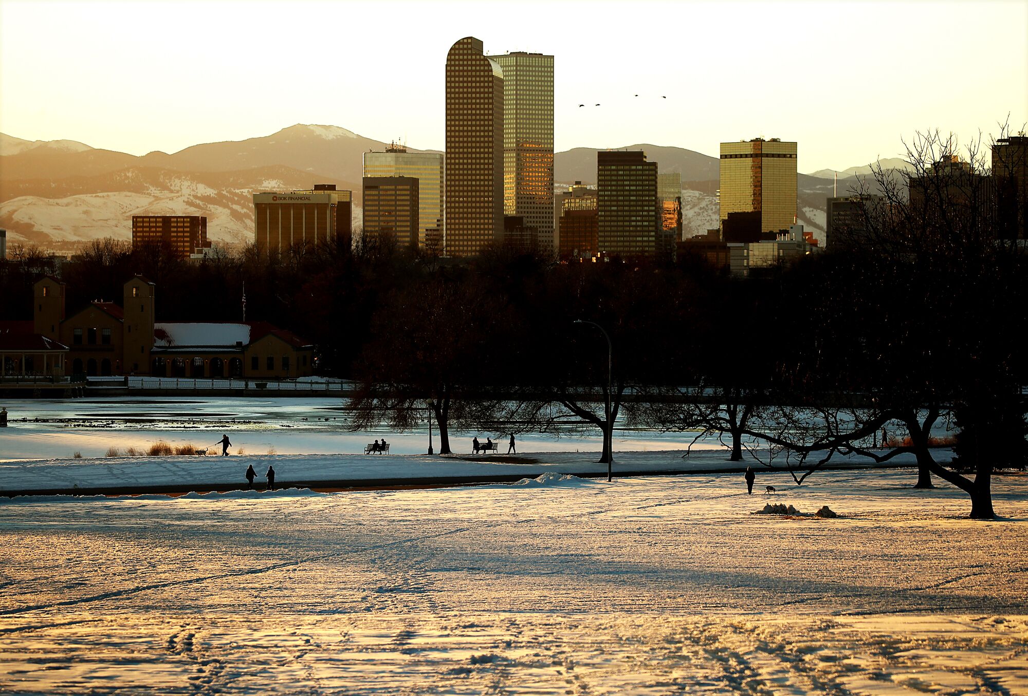 Snow covers an expansive lawn at City Park in Denver, a city of about 715,000.