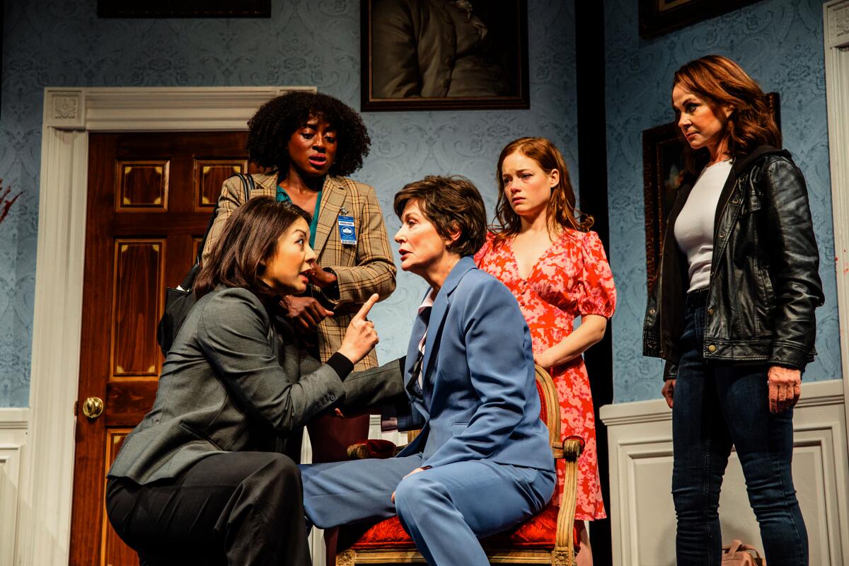 Four women gather around the president's chief of staff in a scene from "POTUS" at Geffen Playhouse.