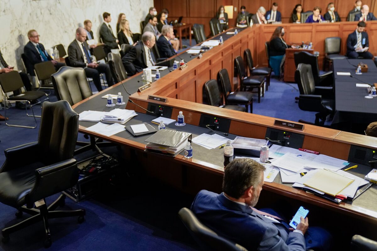 Senator Ted Cruz looks at his phone