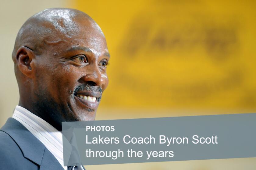 Lakers Coach Byron Scott smiles during his introductory news conference on July 29 at the team's training facility in El Segundo. Scott played for the Lakers for 11 seasons in the 1980s and '90s before returning this year to coach the team.