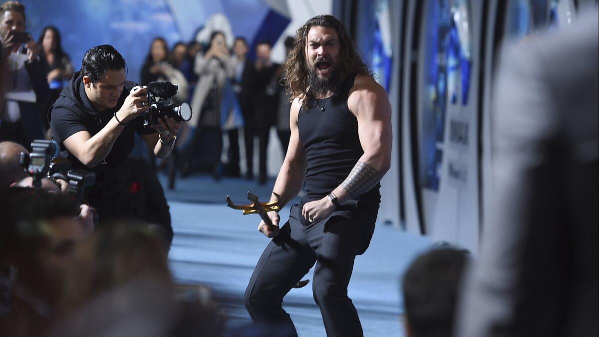 Jason Momoa arrives at the "Aquaman" premiere.