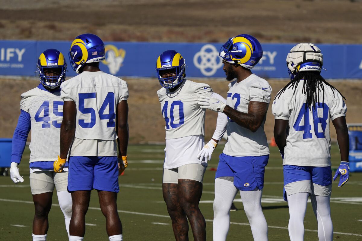 Recently acquired Rams outside linebacker Von Miller (40) mingles with his new teammates.
