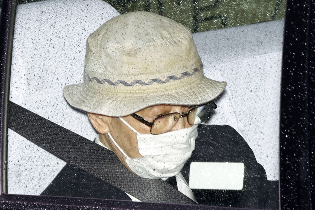 Kozo Iizuka is driven to Tokyo District Court to hear the court's ruling on his car accident in Tokyo Thursday, Sept. 2, 2021. The court on Thursday sentenced the 90-year-old former top bureaucrat to five years in prison in a 2019 fatal car accident on a busy Tokyo street, killing a 3-year-old girl and her mother in a high-profile case in a fast-aging country where elderly driving has become a major safety concern. (Kyodo News via AP)