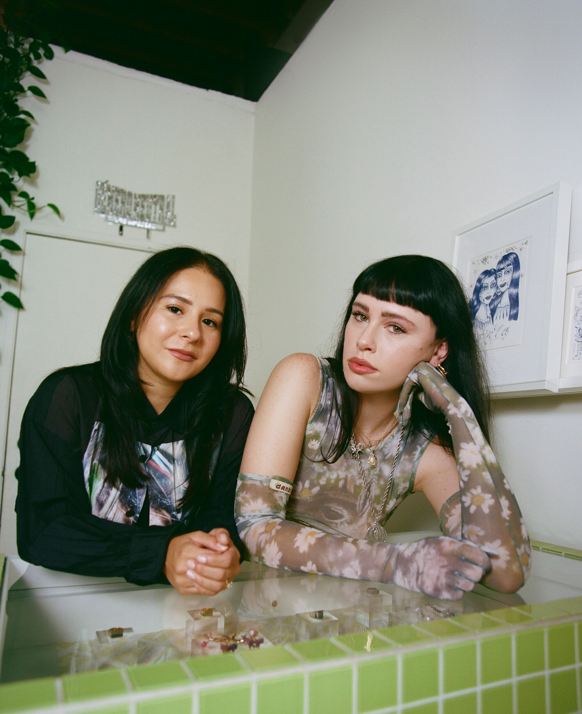 Ashley S.P. and Jennifer Zapata lean on the display case in their concept shop in Echo Park.