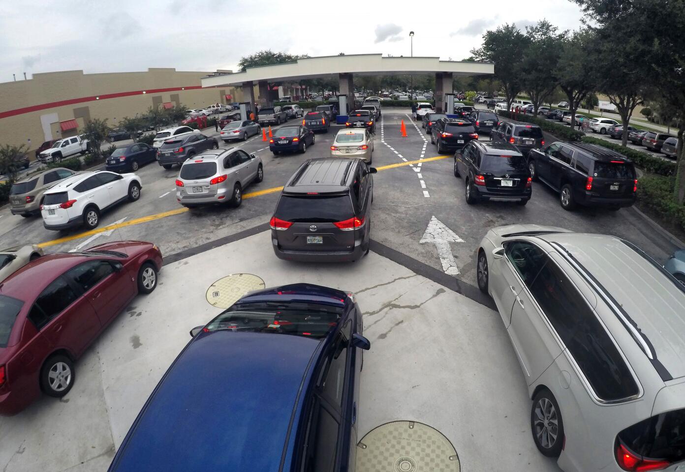 Drivers wait in line for gasoline at the Costco in Altamonte Springs, Fla., ahead of the anticipated arrival of Hurricane Irma on Sept. 6, 2017.