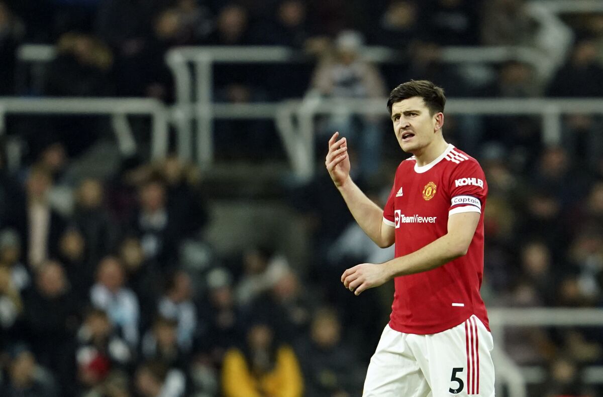 Manchester United's Harry Maguire reacts during the English Premier League soccer match between Newcastle United and Manchester United at St. James' Park in Newcastle, England, Monday, Dec. 27, 2021. (AP Photo/Jon Super)