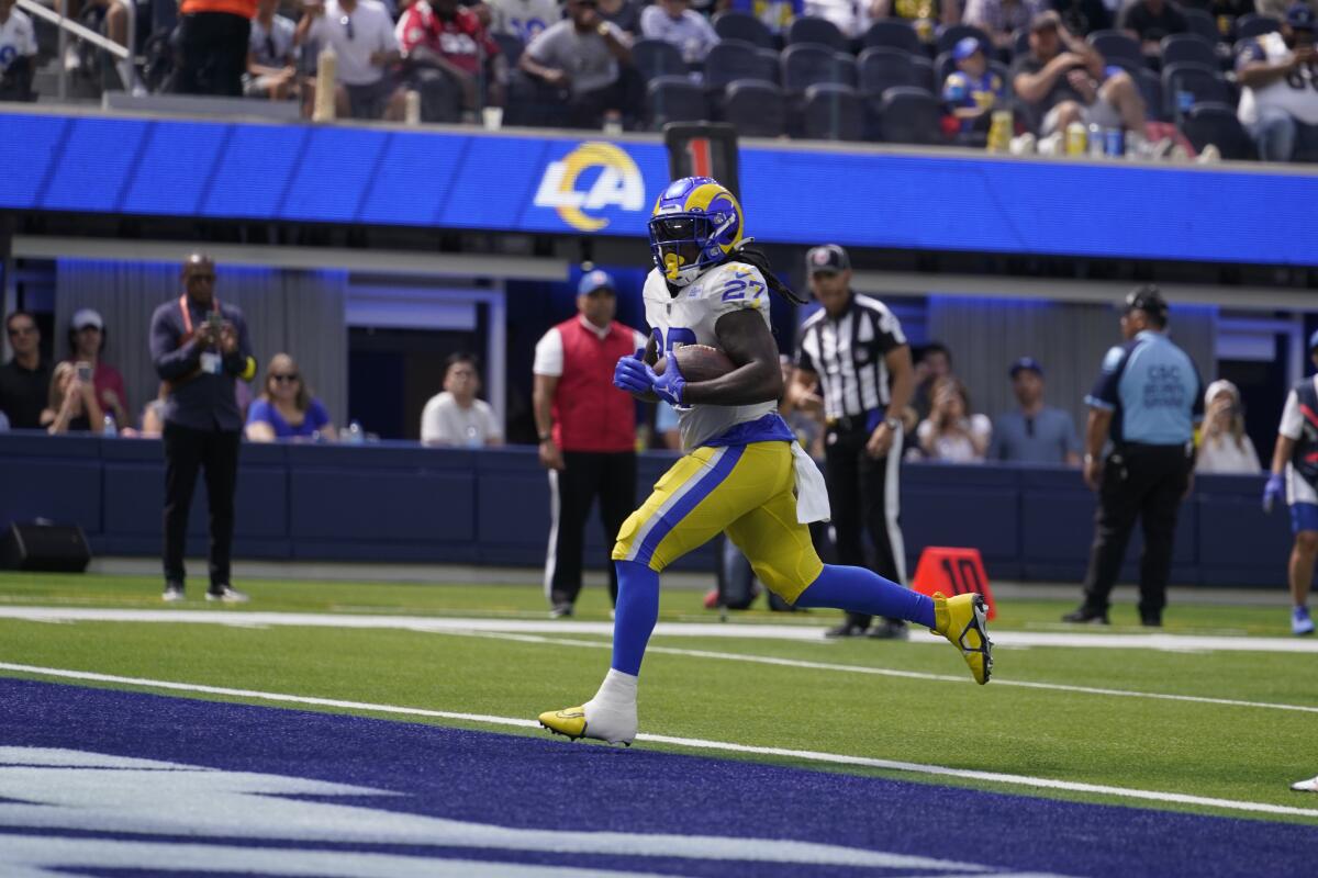 Rams running back Darrell Henderson scores a touchdown against the Falcons in the second quarter.