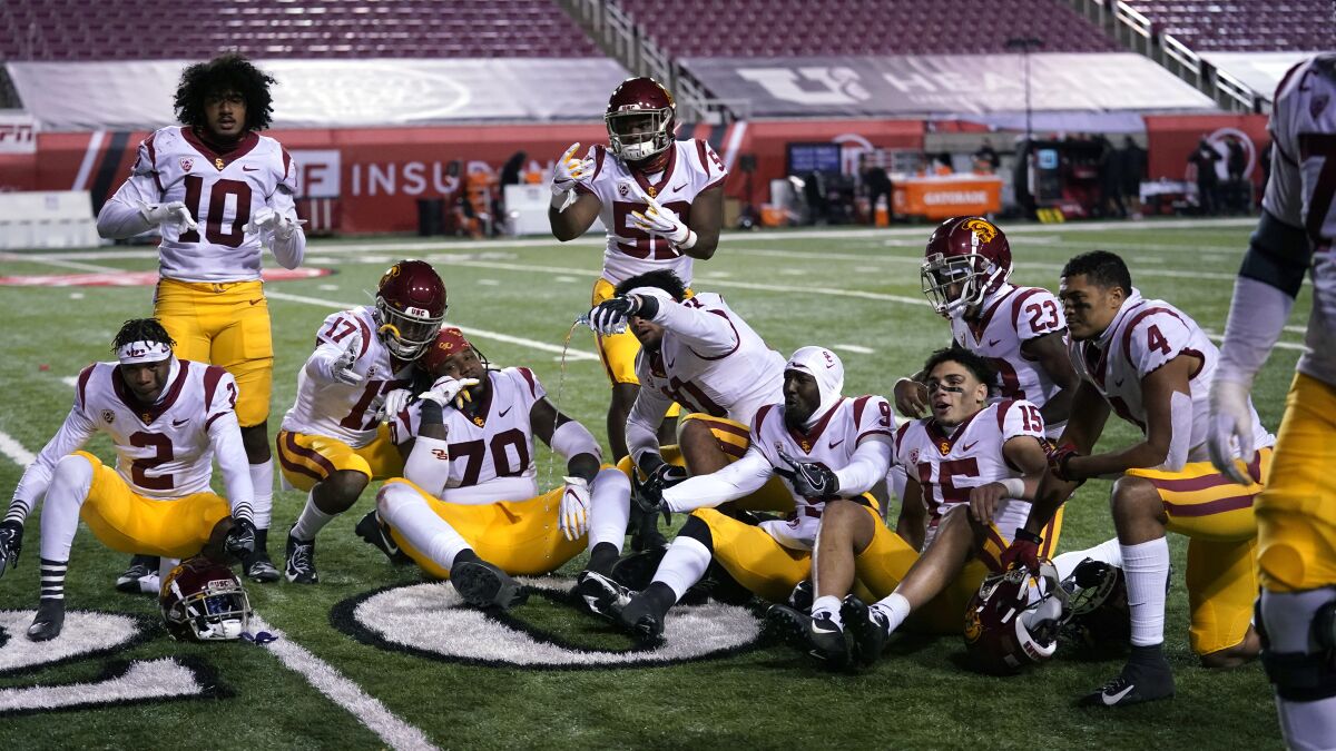 USC players pose for a photo after their game against Utah on Nov. 22, 2020, in Salt Lake City.