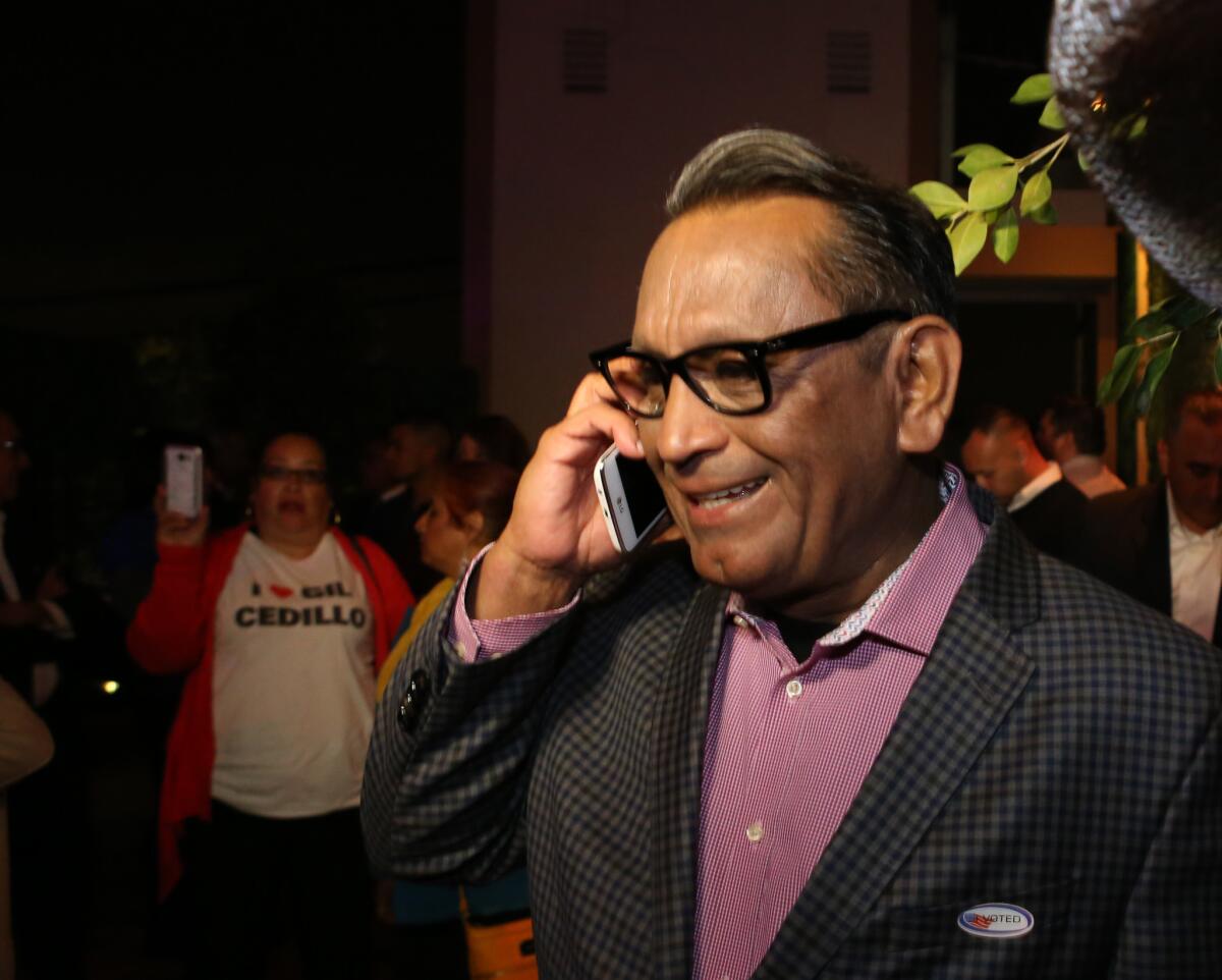 Los Angeles City Counclman Gil Cedillo talks on a cellphone