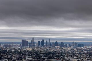 Los Angeles, CA - February 01: Storm clouds linger over the Los Angeles basin in a view from Griffith Observatory on Thursday, Feb. 1, 2024 inLos Angeles, CA. (Brian van der Brug / Los Angeles Times)