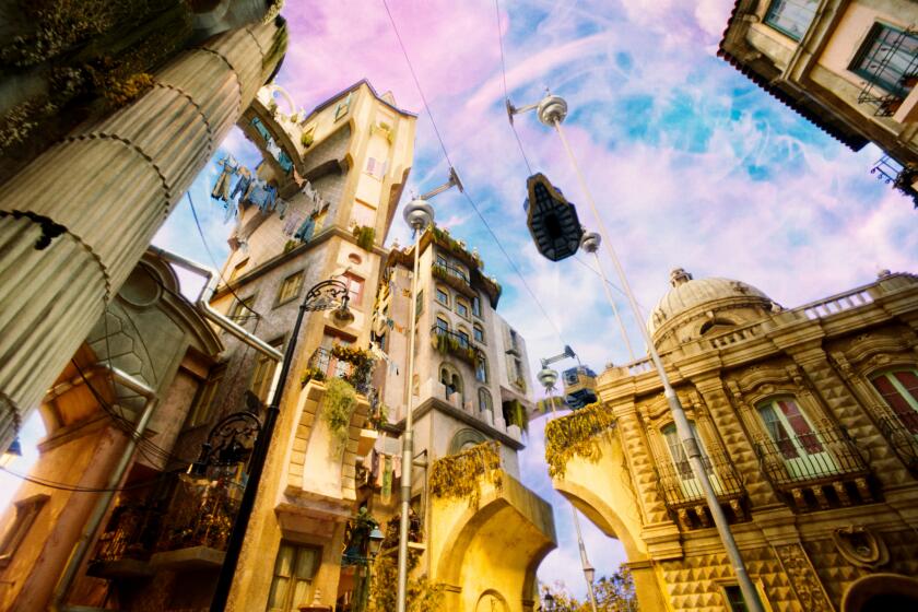 An upward view of a movie set reveals a fantastical city skyline inspired by baroque Lisbon.