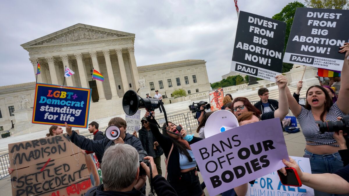 Protesters on both sides of the abortion issue face off in front of the U.S. Supreme Court in Washington, D.C.