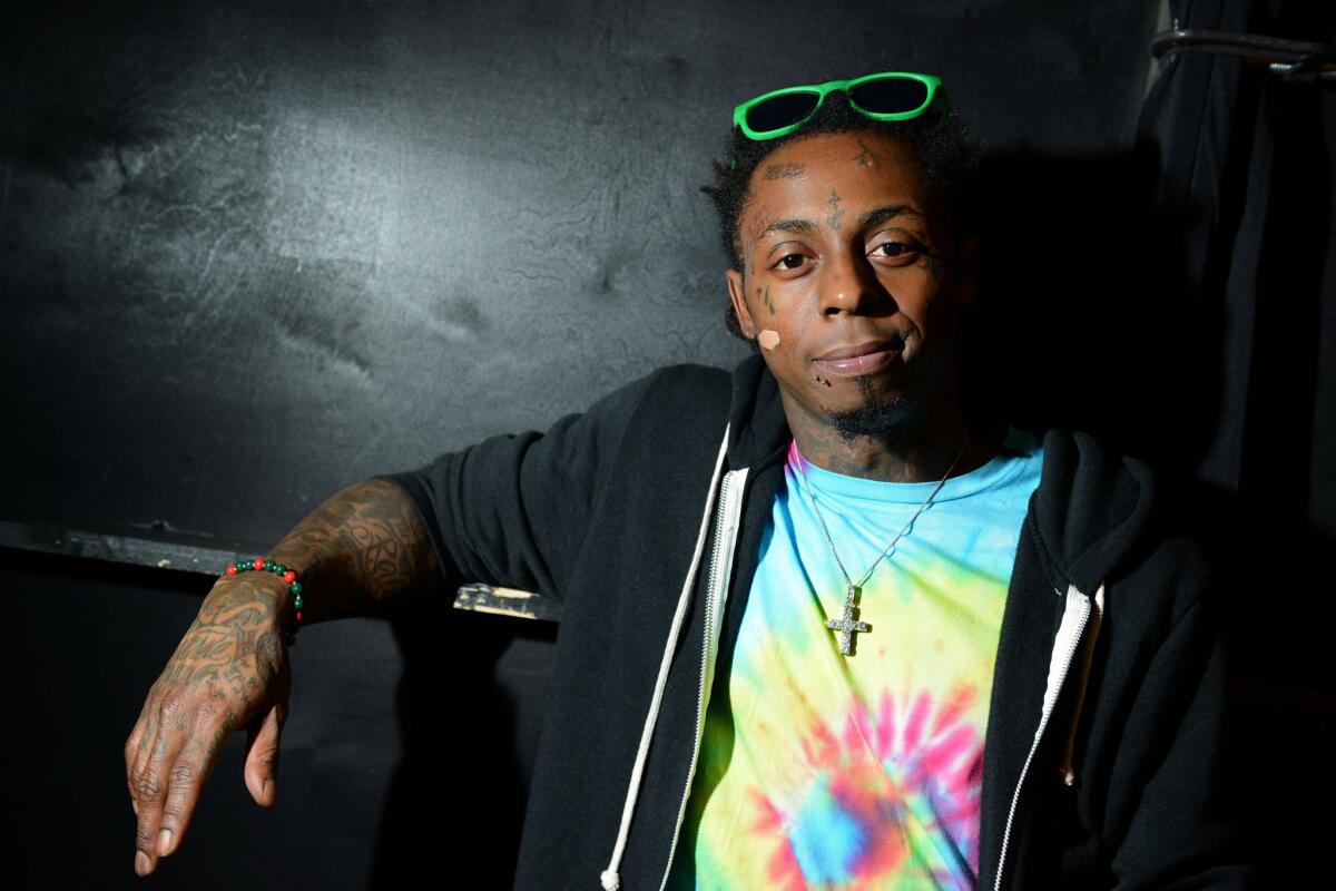 Rapper Lil Wayne, shown in 2013, was not at home when police were falsely alerted about a shooting there, his record label said.