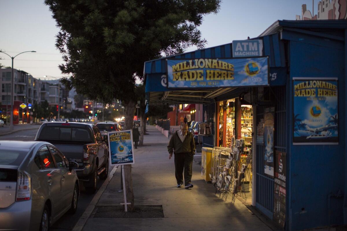 A man walks by Centerfold International Newsstand in Los Angeles.