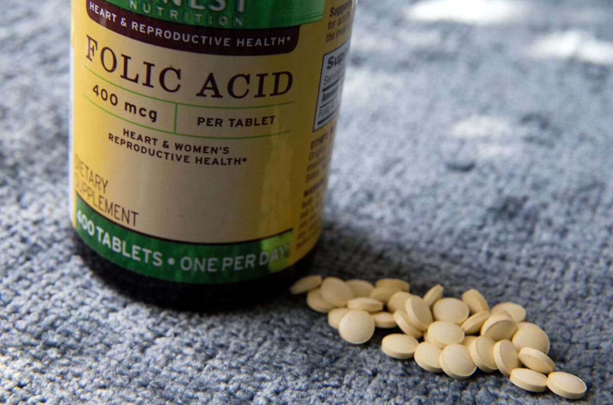 A preliminary report is raising concern that women who take too much folic acid and vitamin B12 during pregnancy could make their children more vulnerable to autism.